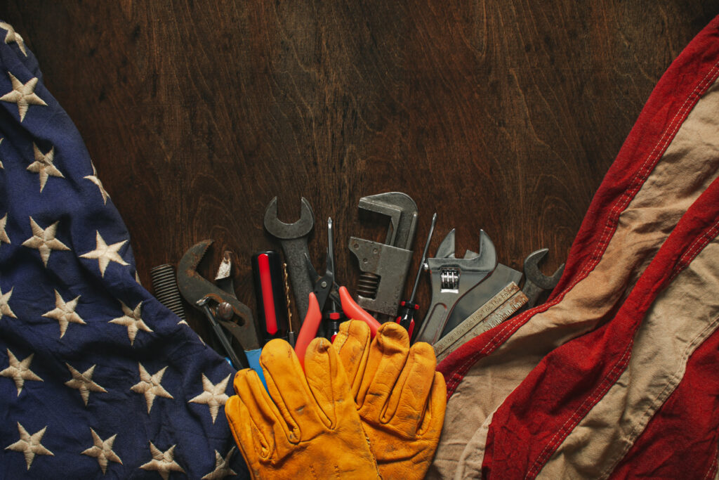 An image of a flag and tools depicting metal stamping in Wisconsin