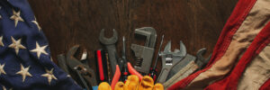 An image of a flag and tools depicting metal stamping in Wisconsin
