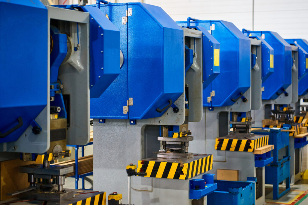 a closeup of the metal stamping process
