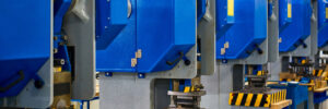 a closeup of the metal stamping process