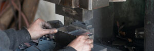 A closeup of progressive metal stamping manufacturers working